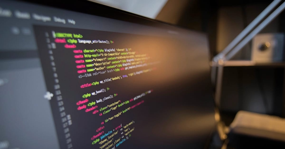 Code on a computer screen, technology background
