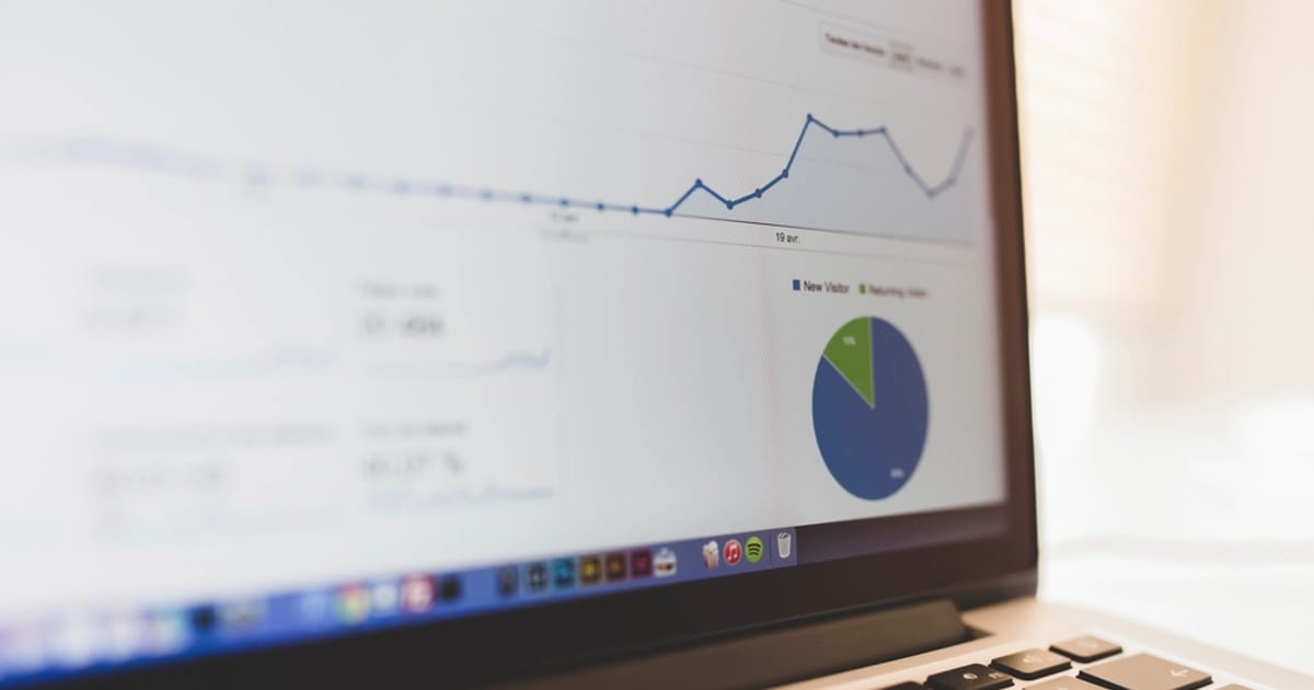 Laptop screen with data on a desk