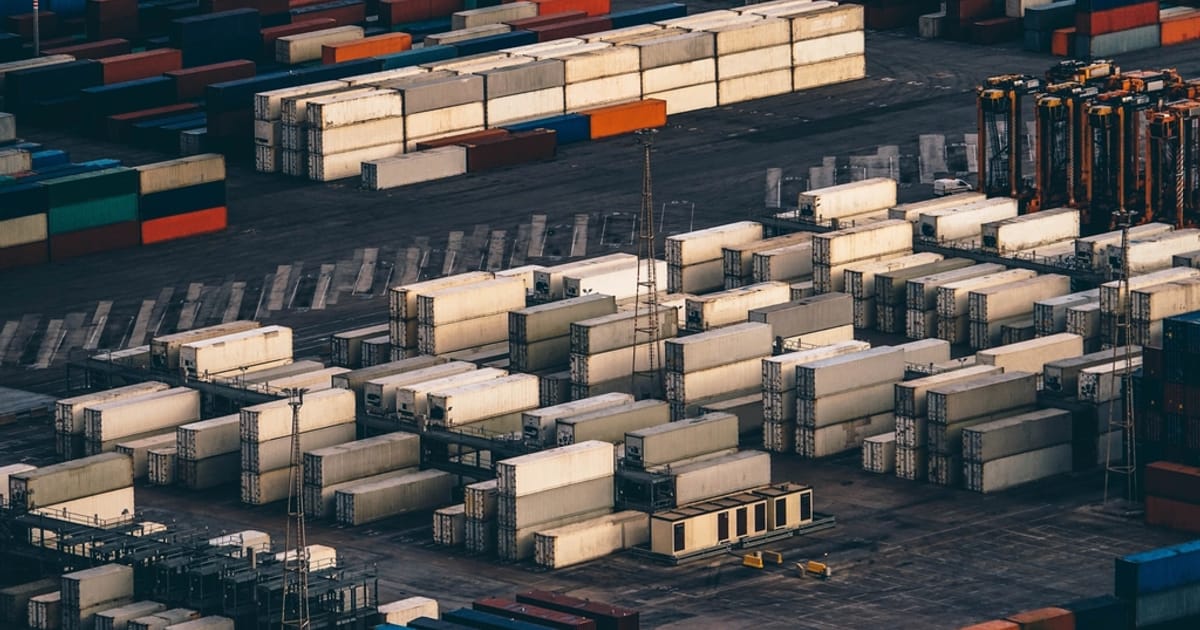 Stacked shipping containers at a cargo port